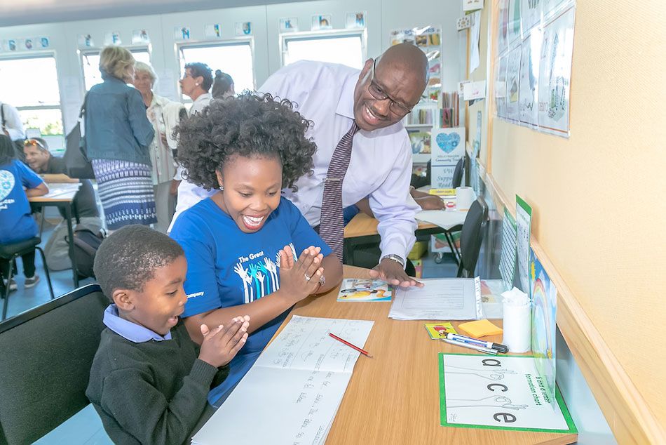Making a difference: Learner Asiphesona Malotana from Mngunube Primary School, KwaNobuhle, Uitenhage, gets some reading assistance from VW for Good volunteer Bongeka Grootboom.