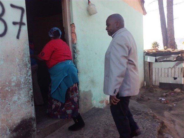 Ida Plaatjies takes land reform deputy minister Mcebisi Skwatsha into one of the homes on the Marlenique Estate in Simondium. Photo: Barbara Maregele