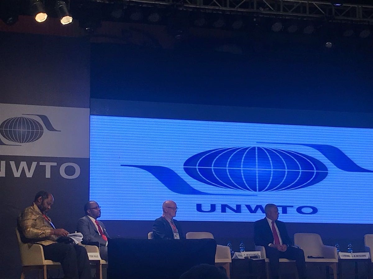 Tourism Minister Derek Hanekom participating in a panel discussion moderated by SA's top Statistician, Pali Lehohla at the UNTWO-CAF meeting in Abuja, Nigeria.
