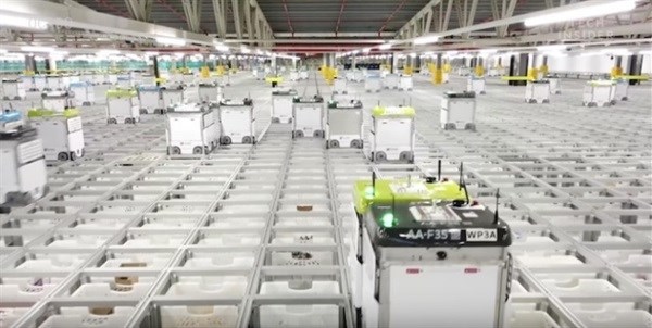 Watch robots pack groceries in Ocado's automated warehouse