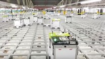 Watch robots pack groceries in Ocado's automated warehouse
