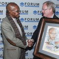 The Forum of Community Journalists (FCJ) bestowed honorary life membership of the FCJ on Joe Thloloe, chairperson of the judging panel of the FCJ Excellence Awards. Here Thloloe receives a gift from Hugo Redelinghuys (executive director of the FCJ) to mark the occasion.
