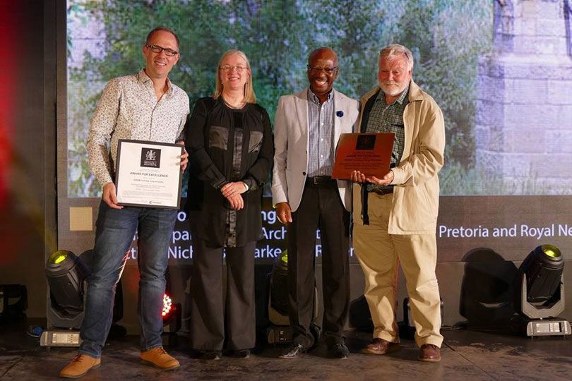 Mr Nicholas Clarke (left) and Prof. Roger Fisher (right) receiving the 2018 Corobrik SAIA Award for Excellence in Architecture from Ms Maryke Cronje, the President of SAIA and Mr Musa Shangase, the Corobrik representative.