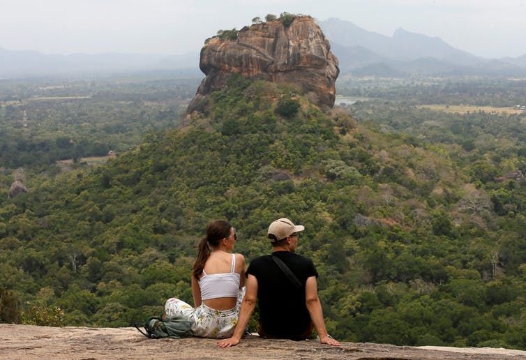 Two tourists go hiking in Sri Lanka. Reuters/Dinuka Liyanawatte