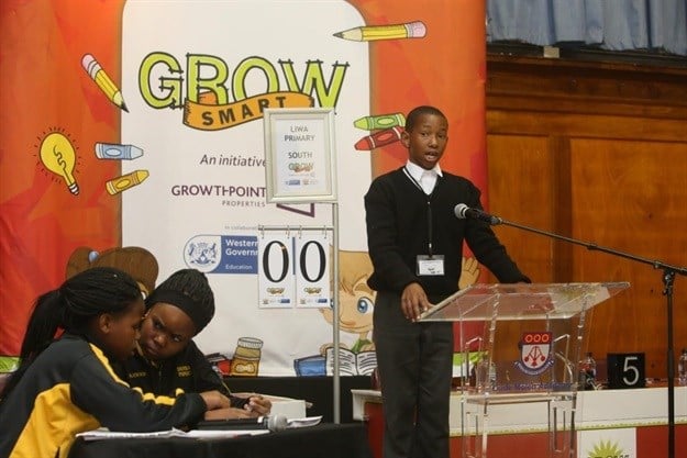 Some of the Growsmart Programme Debating participants deliberating on their final answer while their opponent takes the stand.