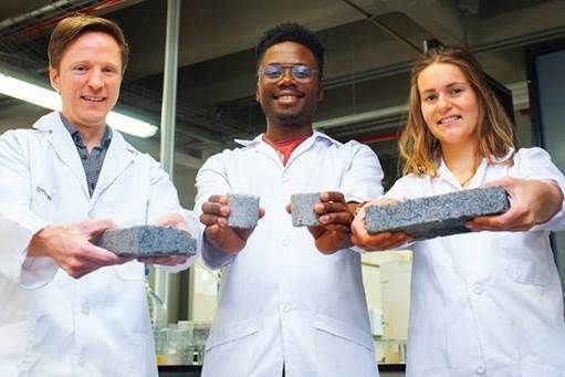 The world’s first bio-brick made using human urine was unveiled at UCT this week. L-R: Dr Dyllon Randall and his students Vukheta Mukhari and Suzanne Lambert. Pic: Robyn Walker