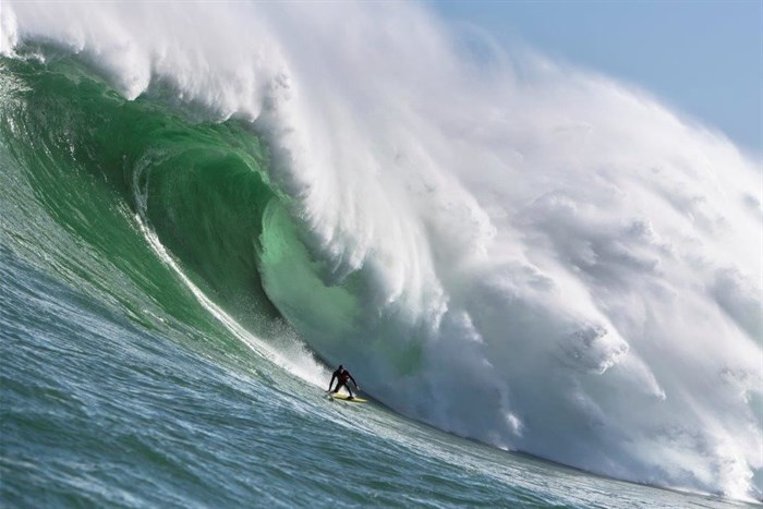 Cape Town surfer Matt Bromley rides a giant wave off Kommetjie, near Cape Town, on Saturday 22 September. Photo Alan van Gysen