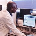 Scientists analysing data at the South-South Malaria Research Partnership project laboratory in Kenya. Flora Mutere-Okuku