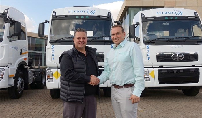 L to R: Eugene van der Berg, regional general manager for FAW SA congratulates Wayne Greenwood, managing director of Choice Diesel Mozambique on their appointment as FAW Mozambique dealers.