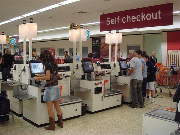 Self-checkout at supermarkets. Image by SchuminWeb, CC BY 2.0,