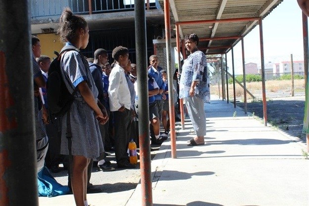 Parents and members of the school governing body at Uitzig Secondary near Elsies River have vowed to continue their fight to keep the school open. Photo: Barbara Maregele / GroundUp