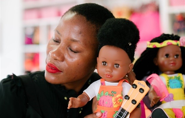 Kwena Baloyi with a Sibahle Collection doll.