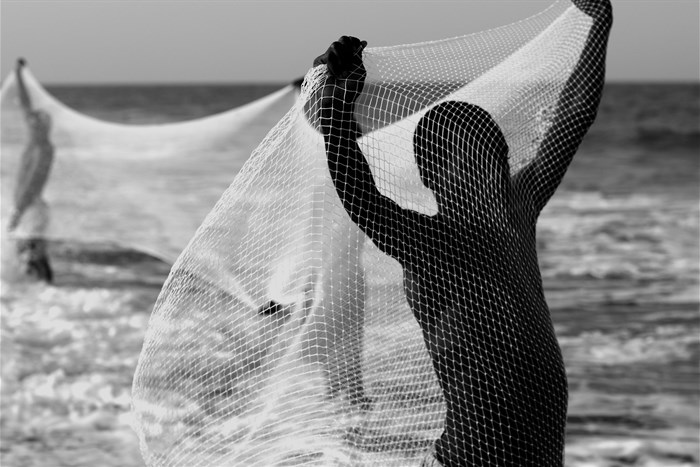 Net Fishing (2018). 60 x 90 cm. Edition of 1/6 + AP. Charity auction proceeds to Gift of the Givers - Estimate ZAR 10,000 - 15,000 - Image courtesy of the artist and Guns & Rain