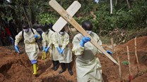 Health workers burying a child who died of Ebola in the DRC’s North Kivu province. Hugh Kinsella Cunningham/EPA