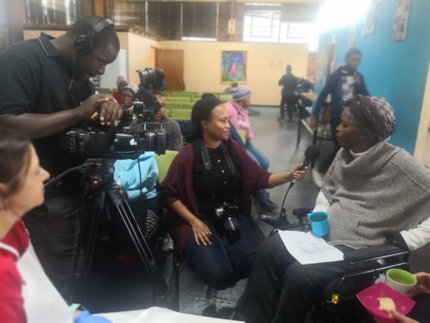 Nthabiseng Molongoana (right) from the Association of and for Persons with Disabilities in Bloemfontein being interviewed for television at Tuesday’s World Hunger Day event held at the Kopano Workshop in Bloemfontein.