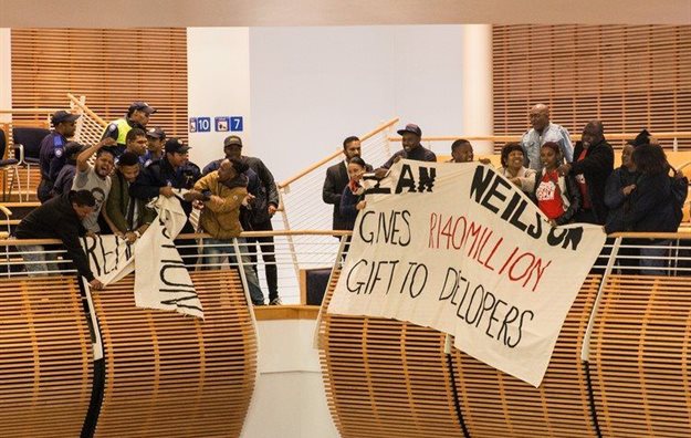 Reclaim the City activists briefly disrupted a Cape Town City Council meeting on Thursday. Photo: Ashraf Hendricks