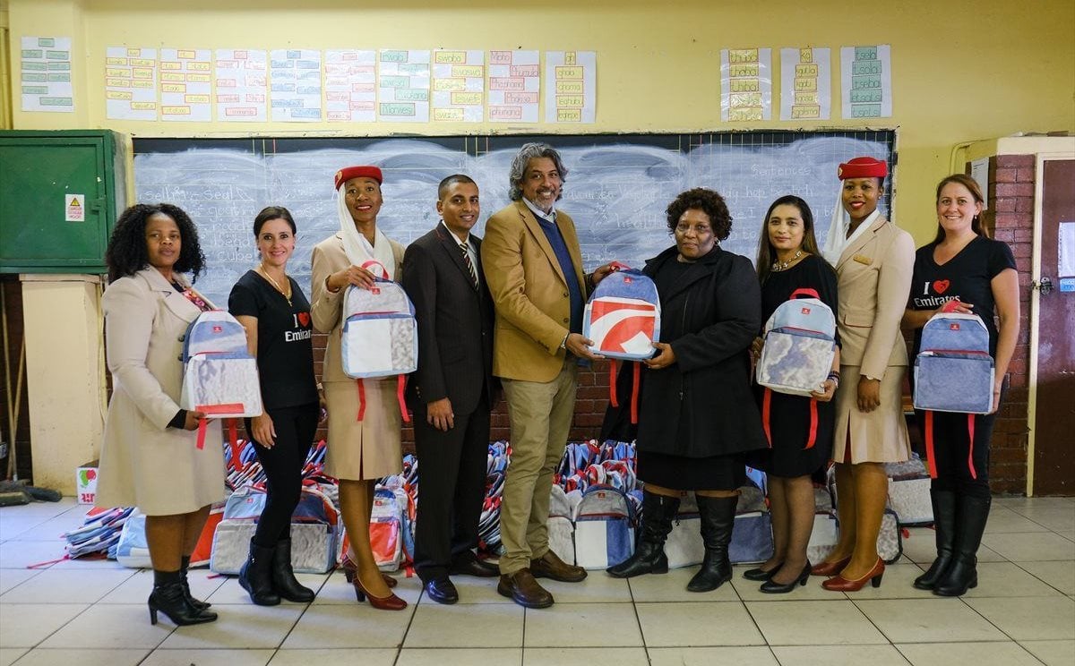 Thembakazi Giyama, Principal of Emfundisweni Primary School in Alexandra with Fouad Caunhye, Regional Manager of Emirates Southern Africa (both centre), with staff of the school and Emirates.