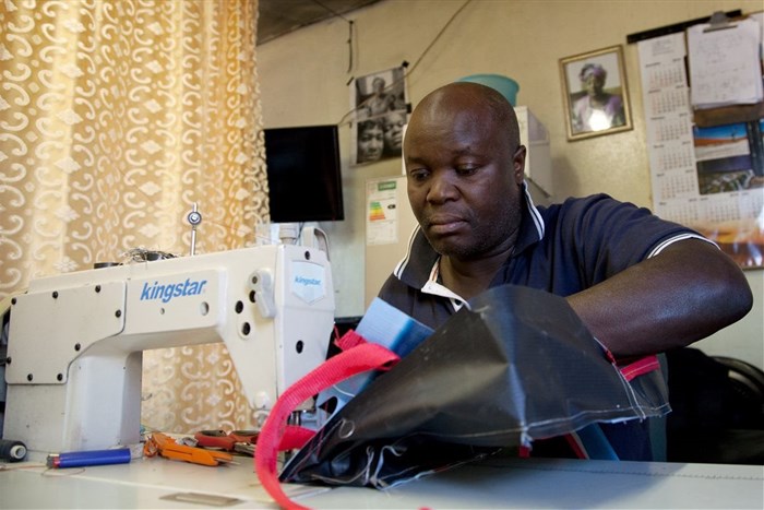 Raymond Phiri, owner of Motion Bags, makes the sustainable Emirates school bags