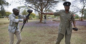 A Kenyan journalist has an altercation with a police officer. EPA/Dai Kurokawa