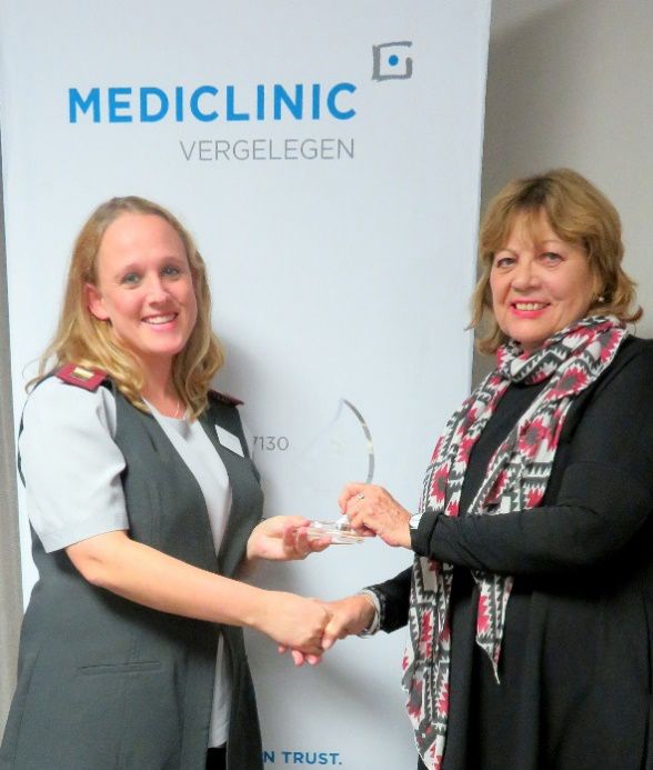 Michelle Zietsman, Learning and Development Facilitator received the Katrin Kleijnhans Quality Trophy in 2019 at Mediclinic Vergelegen from COHSASA Communications Manager, Ms Marilyn Keegan.