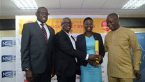 NSE boss Geoffrey Odundo, Brand Integrated partner Richard Mukoma present an award for the most admired brand in the food category in Kenya to Del Monte Kenya marketing manager – Margaret Nyoro, at the Most Admired Brands event at the Exchange in Nairobi. Looking on is Thebe Ikalafeng, founder and chairman of Brand Africa and Brand Leadership – the founders of the annual African survey. Image supplied.