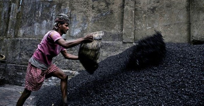 A worker makes coal chips for combustion in Calcutta. India’s demand for energy is growing fast. EPA/PIYAL ADHIKARY