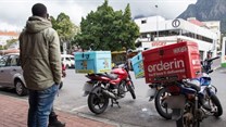 Immigrant food couriers risk death on South African roads
