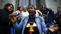 Environmental activists celebrate court ruling against a proposed nuclear deal for South Africa. EPA/Nic Bothma