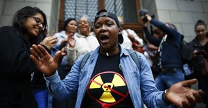 Environmental activists celebrate court ruling against a proposed nuclear deal for South Africa. EPA/Nic Bothma