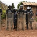 Ugandan police officers are seen in Kampala on April 23, 2019. Police recently arrested Joseph Kabuleta for allegedly posting “offensive communication against the person of the President” online. Credit: CPJ/AFP/Isaac Kasamani.