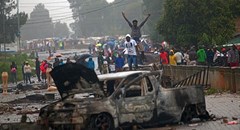 Community members in Zandspruit west of Johannesburg block roads after their illegal electricity connections were removed. EPA/Kevin Sutherland