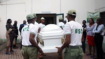 Members of the National Youth Service Corp carry the body of their colleague, the reporter Precious Owolabi, in Abuja on July 23. Owolabi was shot while covering protests in the Nigeria capital. Credit: CPJ/AFP/Kola Sulaimon.