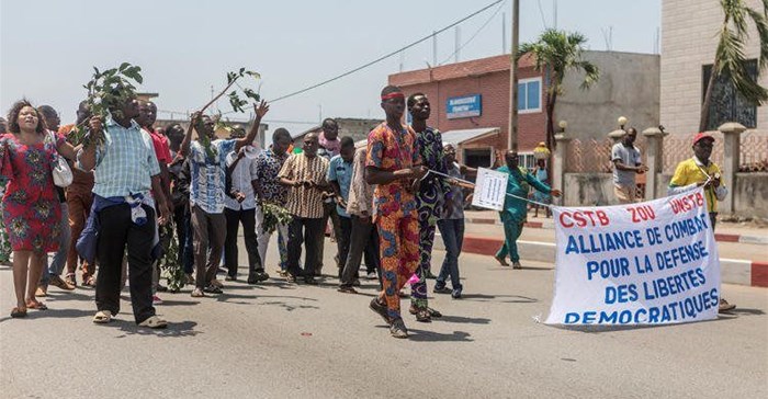 Protesters from two of Benin's unions take part in a demonstration after the parliament approved a law restricting to 10 days public sector employees’ right to strike, on September 13, 2018, in Cotonou. Journalist Ignace Sossou convicted of false news in Benin on August 12, 2019. Crdit: CPJ/AFP/Yanick Folly.