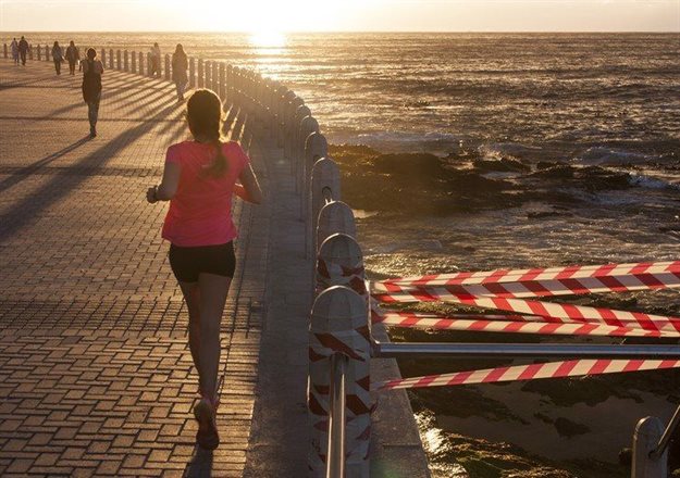 A stairway on the popular Sea Point promenade is cordoned off due to damage by winter storms. Photo: Steve Kretzmann