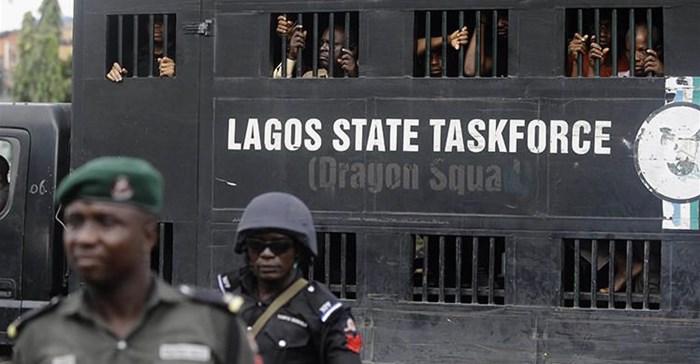 Police officers are seen in Lagos, Nigeria, on August 5, 2019. Lagos police recently arrested publisher Agba Jalingo, who has been charged by federal authorities with treason. Credit: CPJ/AP/Sunday Alamba.