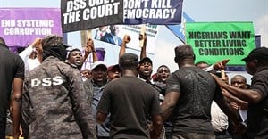 Demonstrators are seen outside the Department of State Services headquarters in Abuja, Nigeria, on November 12, 2019. Police fired on and attacked journalists covering that demonstration. Credit: CPJ/AFP/Kola Sulaimon.