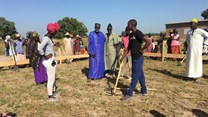 From L-R: The team from buildOn and the village Chief (blue robe) and Iman (white robe) preparing to break ground on the construction of the “GE Switzerland School” that will educate 150 learners from Kaolack.
Source: GE