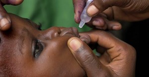 A Nigerian child receives a dose of the polio vaccine. EPA