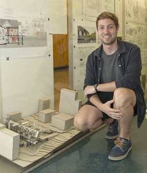Ian McBride pictured with a model of his proposed thesis.
