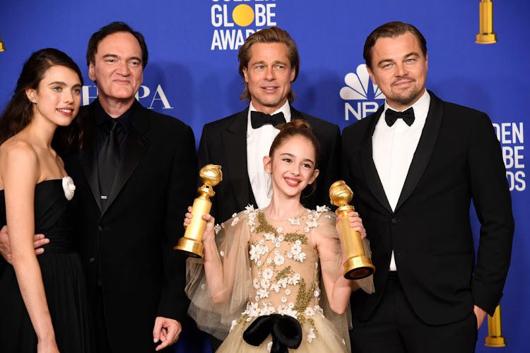 Director Quentin Tarantino (far left) with 'Once Upon a Time in Hollywood' stars Margaret Qualley, Brad Pitt, Leonardo DiCaprio and Julia Butters (front) - © Kevork Djansezian/NBC/NBCU Photo Bank via Getty Images