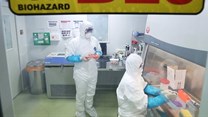 Researchers examine materials collected from a Chinese woman to find the cause of her mysterious pneumonia symptoms, at Korea Centers for Disease Control and Prevention, South Korea, 09 January 2020.