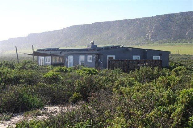 The first beach house built illegally in 2012 by Cape Town businessman Parkin Emslie on the coastal strip near Elands Bay. It was destroyed by fire in 2018. Photo: John Yeld