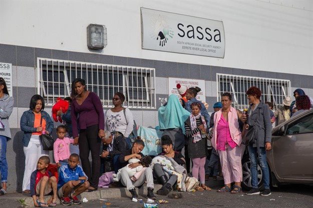 People queue for social grants outside the SASSA office in Eerste River. Archive photo: Ashraf Hendricks