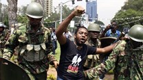 Kenyan activist Boniface Mwangi is arrested during a protest in Nairobi in 2014. AFP via Getty Images.