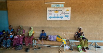 Women and children wait to be treated at a health clinic in northern Burkina Faso. Giles Clarke/UNOCHA via Getty Images