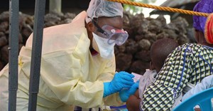 A child receives a vaccine against Ebola from a nurse in Goma on August 7, 2019. AUGUSTIN WAMENYA/AFP via Getty Images