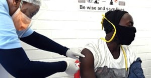A volunteer receives an injection from a medical worker during the country’s first human clinical trial for a potential vaccine against Covid-19 in Soweto, South Africa. Felix Dlangamandla/Beeld/Gallo Images via Getty Images