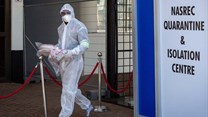 A healthcare worker in a protective suit is seen at a quarantine and isolation centre in Johannesburg, South Africa.