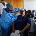 A nurse demonstrates how to perform a swab test in Johannesburg, South Africa. Michele Spatari / AFP via Getty Images