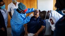 A nurse demonstrates how to perform a swab test in Johannesburg, South Africa. Michele Spatari / AFP via Getty Images